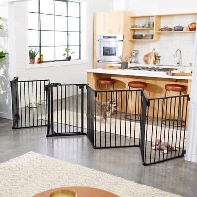 Frisco Steel 8-Panel Configurable Dog Gate and Playpen in black, configured in a home kitchen