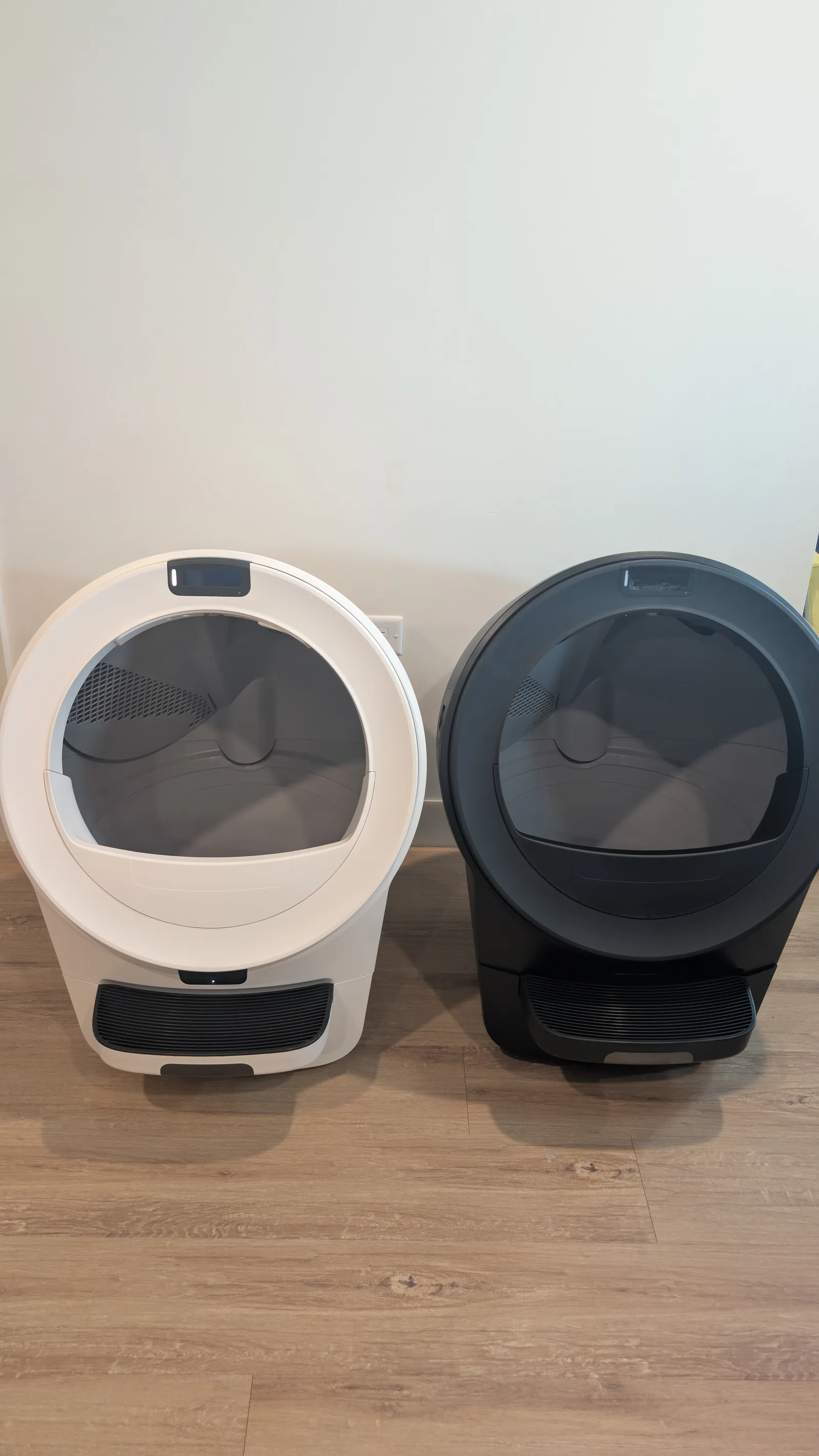 White Litter-Robot 5 Pro beside another Litter-Robot in a home