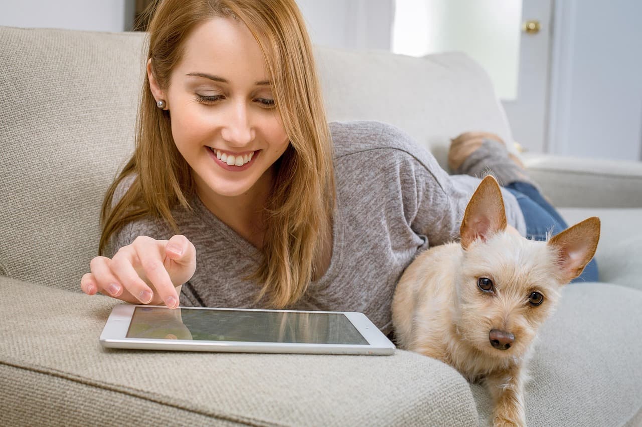 pet costs as woman sits with dog